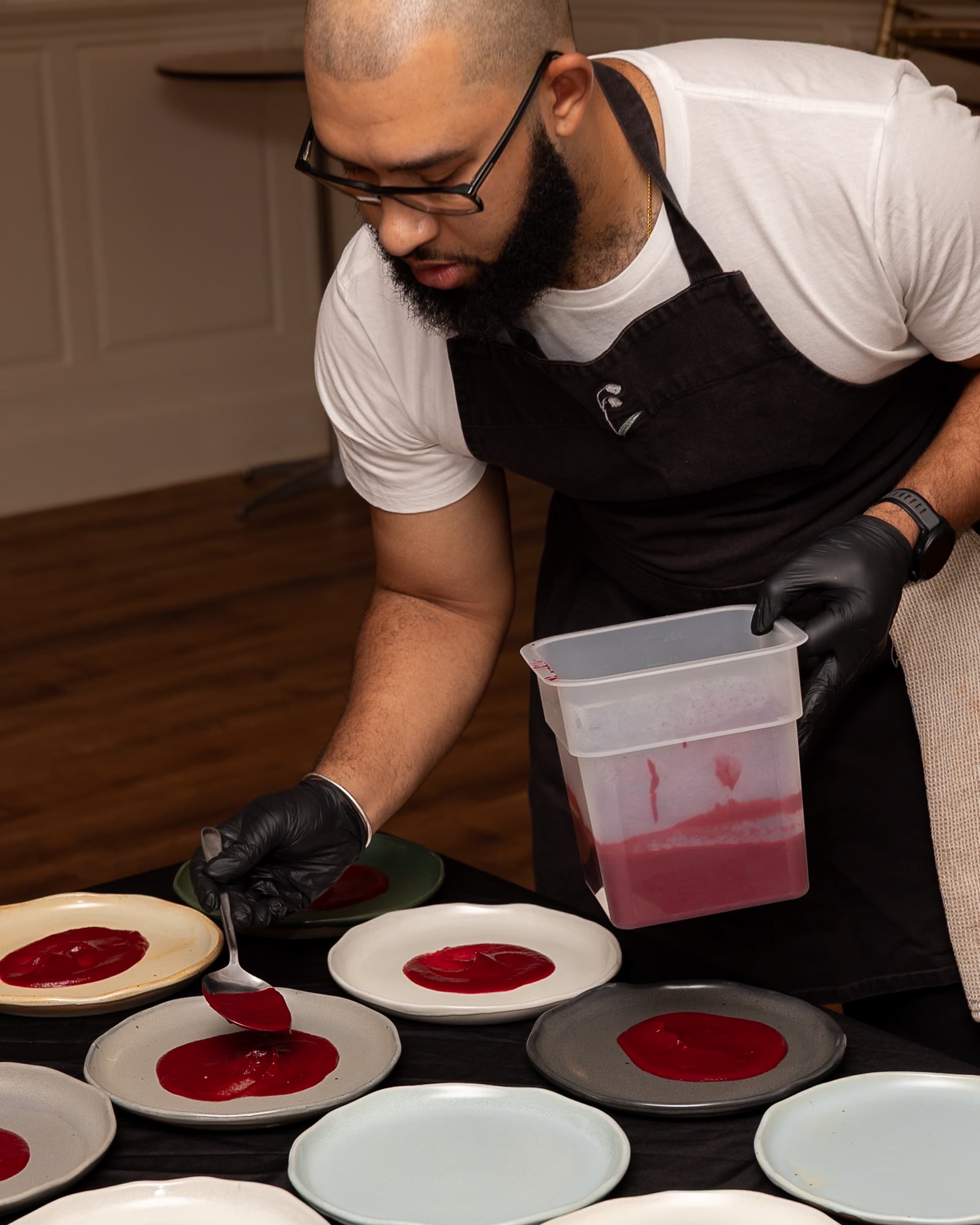 Chef Marcel plating the charred vegetable course